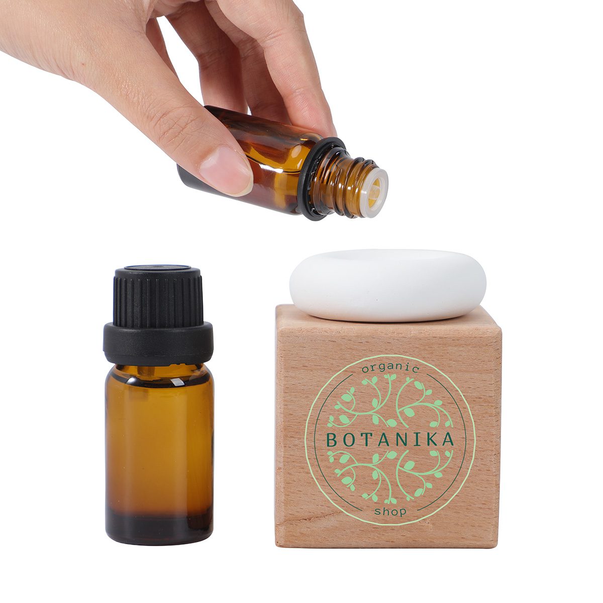 Aromatherapy essential oil bottles with a wooden diffuser, promoting relaxation and wellness.