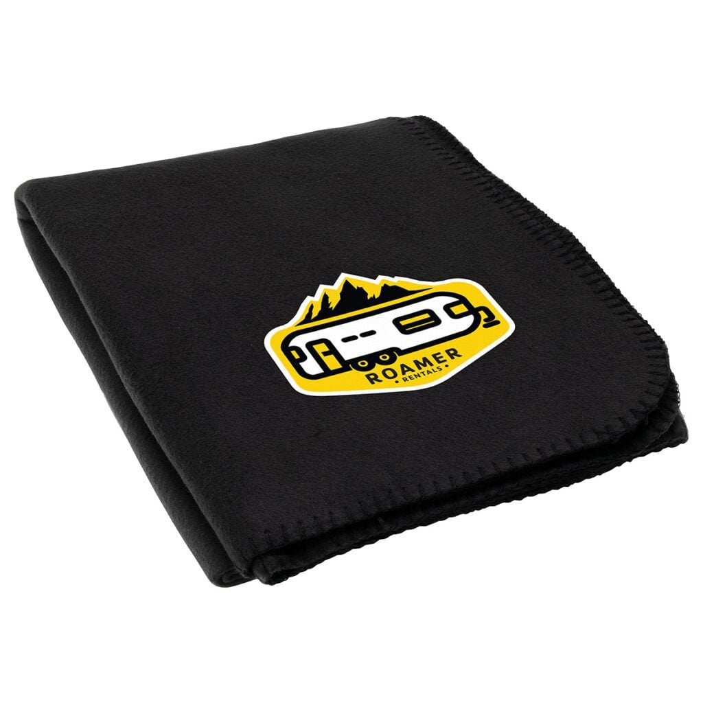 Black fleece blanket with Roamer logo for outdoor use.