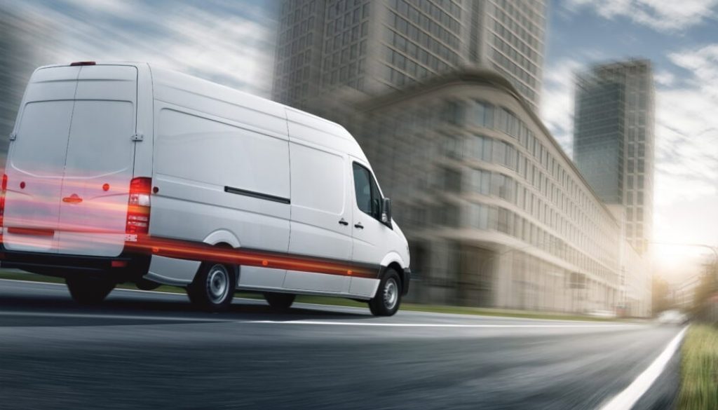 Delivery van delivers in a city