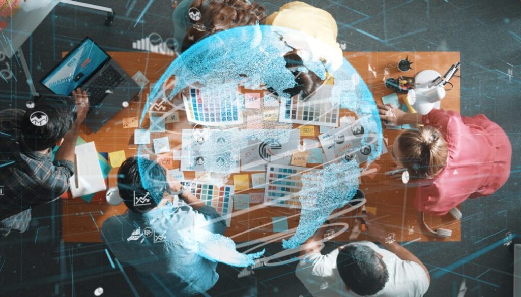 Top view of creative designer work together with hologram of global Symposium