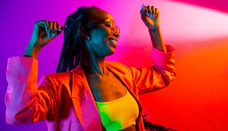 Beautiful afro woman with pigtails and stylish clothes