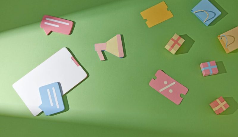 Flat design with multiple shopping themed items on a soft gradient background such as coupons purchase receipts speakers shopping bags boxes Illustrate consumer behavior or market trends
