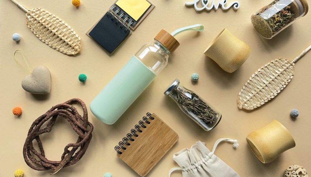 Zero waste tea background low impact alternatives to plastic objects in making tea on yellow paper