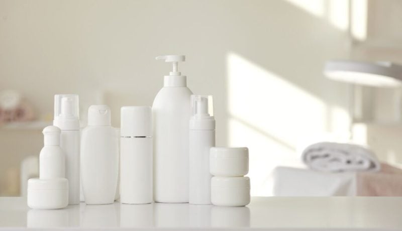 Wide selection set of natural organic cosmetics for skin care is on table in beauticians office