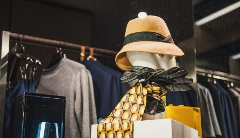 Women clothing on hangers in a store in Milan