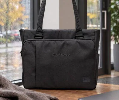 Herschel tech tote with the exact uppercase words YOUR LOGO embroidered directly on the front panel.